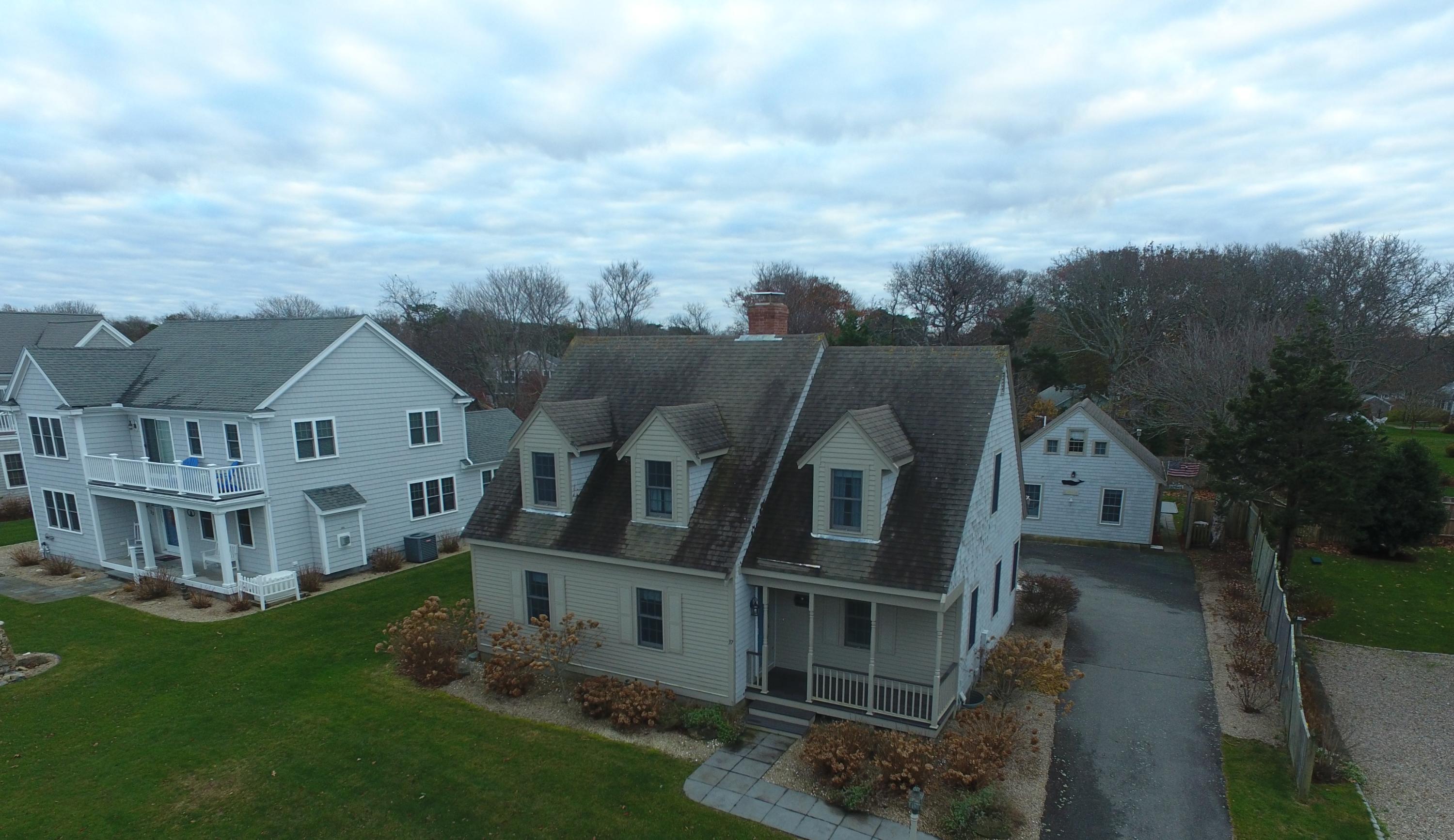 37 Horsefoot Path Dennis, MA 02638 - Photo 49 of 50 an aerial view of a house next to a big yard