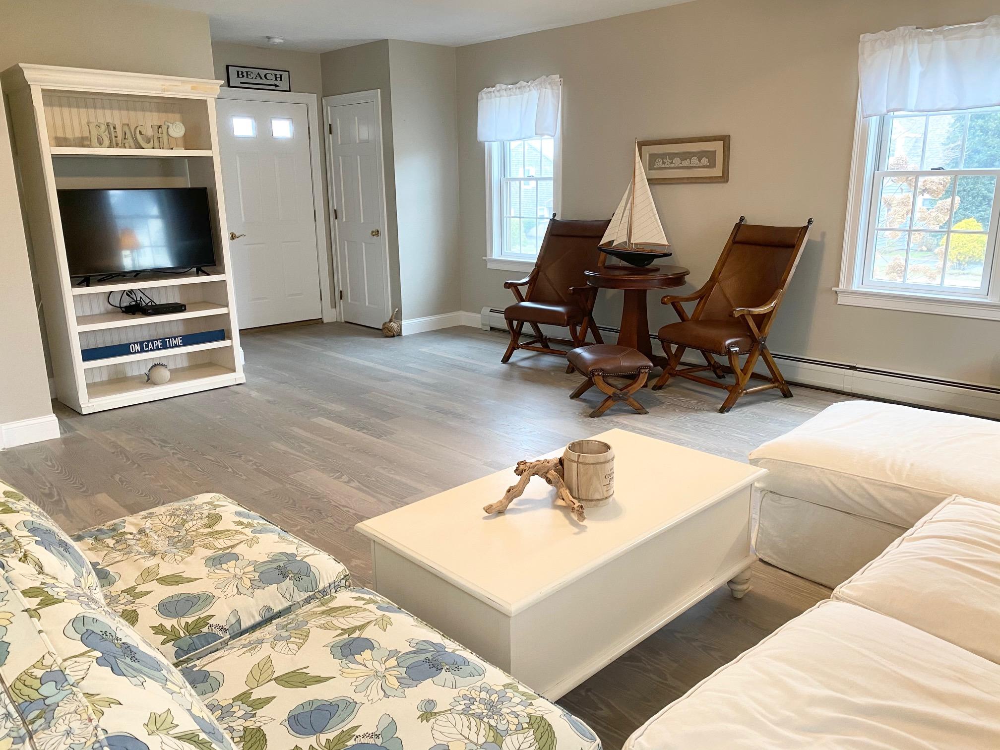 37 Horsefoot Path Dennis, MA 02638 - Photo 5 of 50 a living room with furniture and a flat screen tv