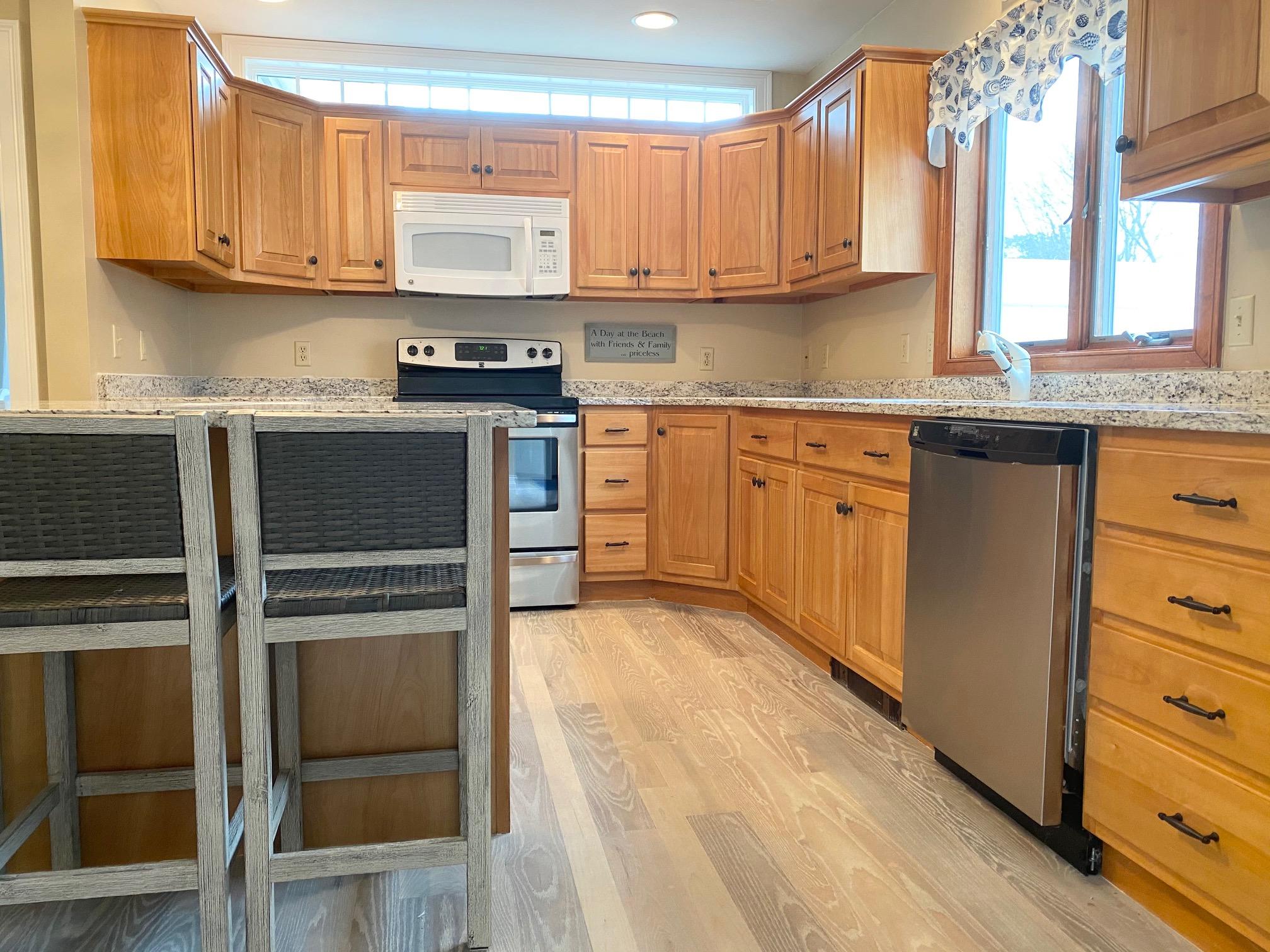 37 Horsefoot Path Dennis, MA 02638 - Photo 7 of 50 a kitchen with granite countertop a stove a sink and a refrigerator