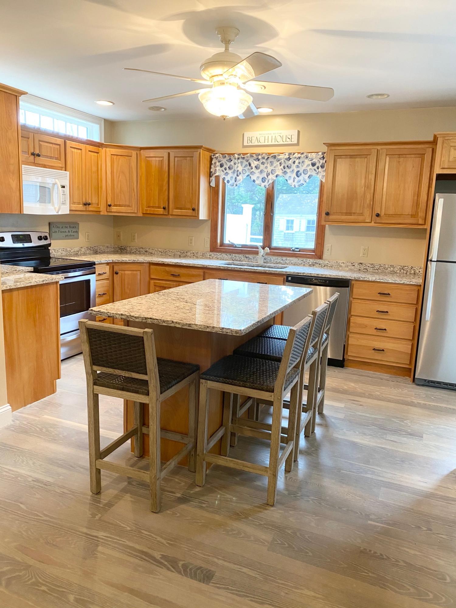 37 Horsefoot Path Dennis, MA 02638 - Photo 8 of 50 a dining table with chairs and wooden floor