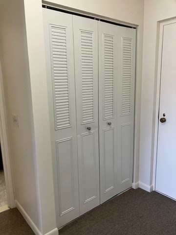 763 Main Street, Unit 44 Waltham, MA 02451 - Photo 2 of 11 a view of a room with a wooden floor