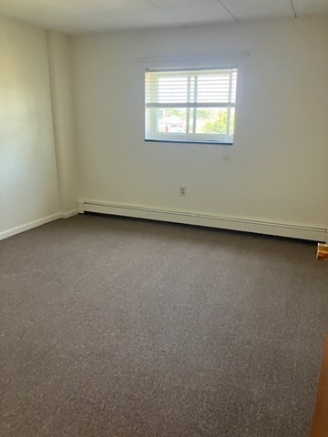 763 Main Street, Unit 44 Waltham, MA 02451 - Photo 8 of 11 an empty room with a window