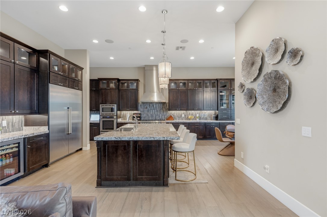 5 Crystal Tree Pass Henderson, NV 89052 - Photo 11 of 67 Granite counters and stainless steel appliances complete this spacious, open-concept kitchen.