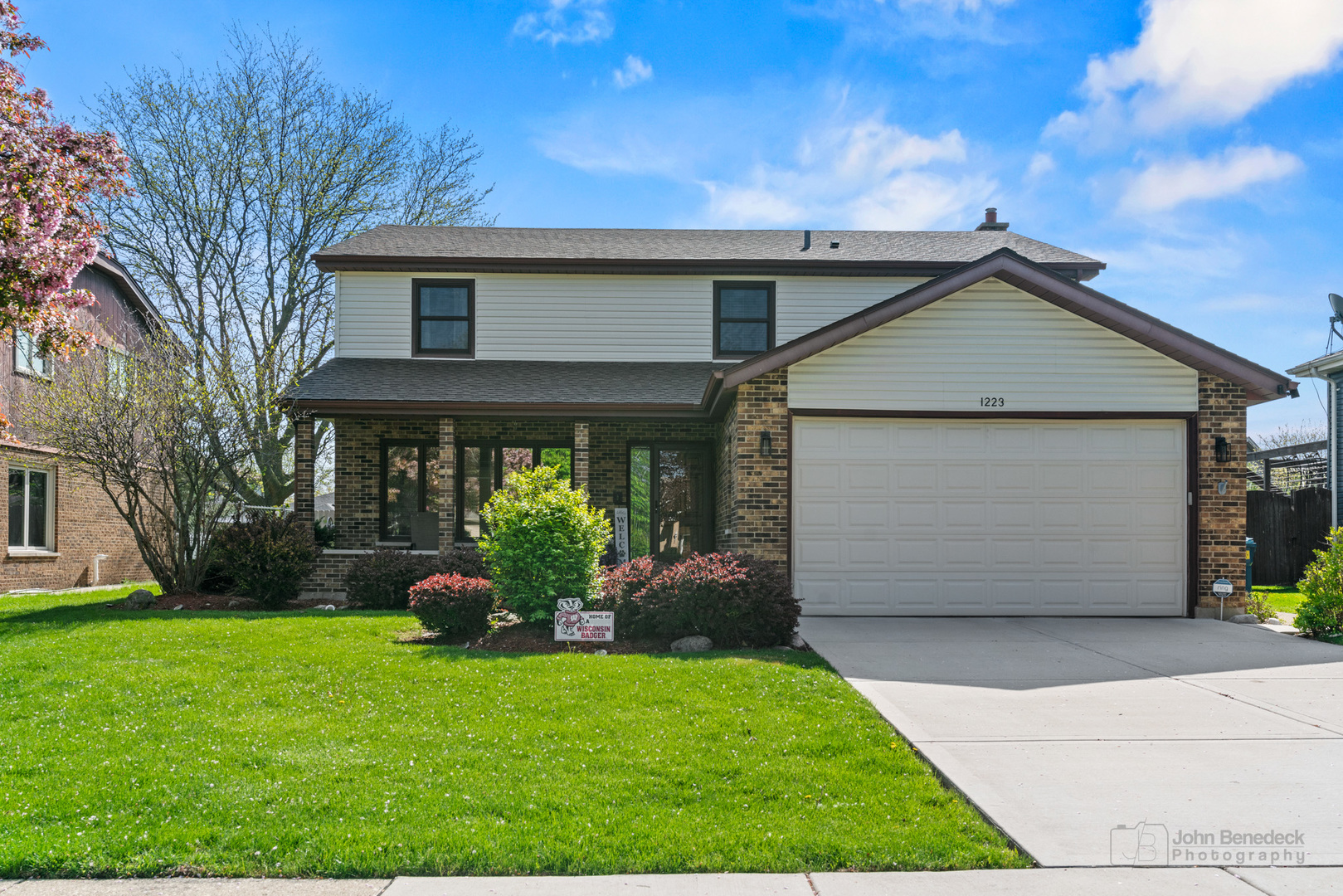 a front view of house with garden