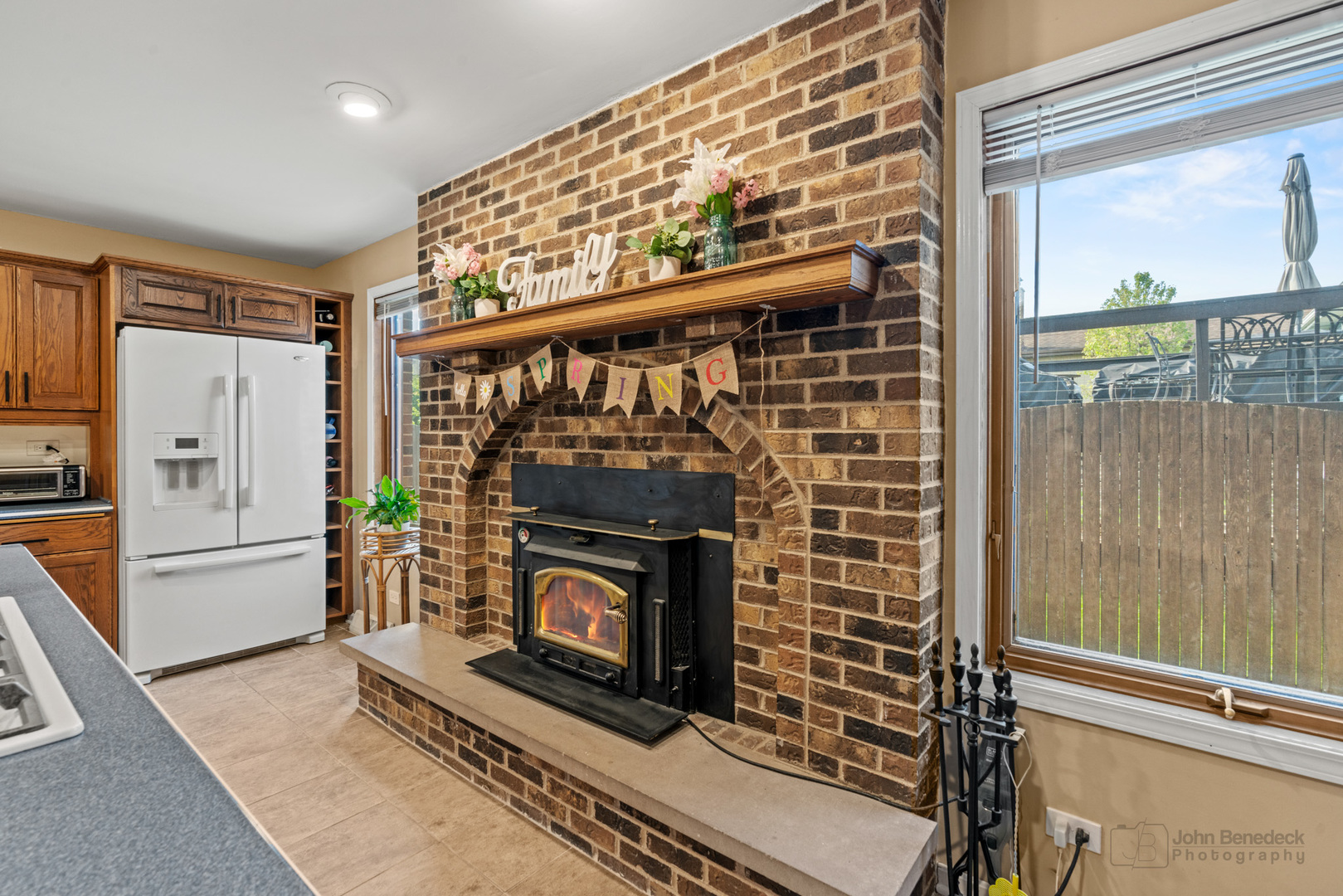1223 Itasca Road Addison, IL 60101 - Photo 12 of 42 a living room with furniture a flat screen tv and a fireplace