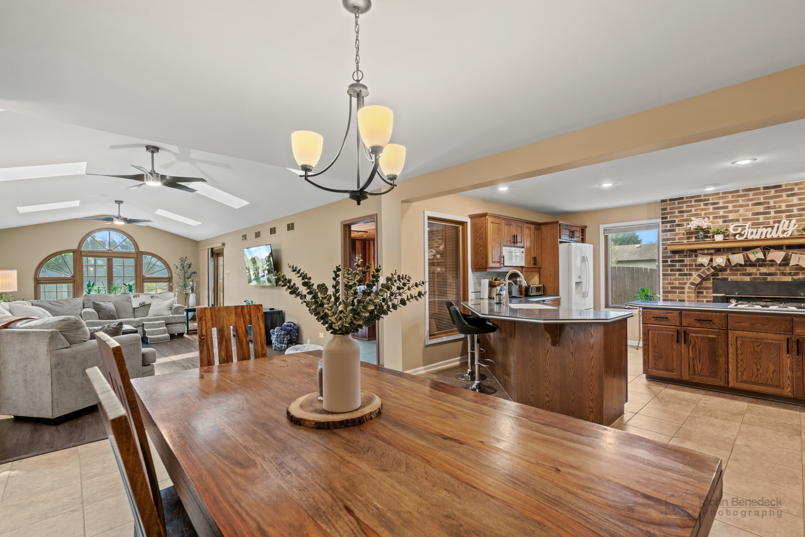 1223 Itasca Road Addison, IL 60101 - Photo 14 of 42 a view of a dining room with furniture a kitchen and chandelier