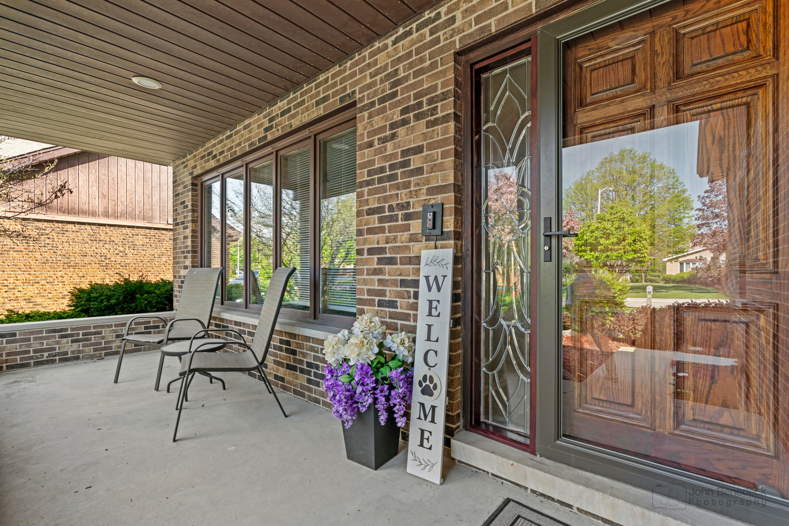 1223 Itasca Road Addison, IL 60101 - Photo 2 of 42 a view of a porch with furniture and floor to ceiling window
