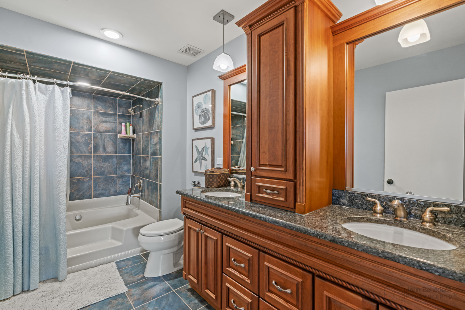 1223 Itasca Road Addison, IL 60101 - Photo 26 of 42 a bathroom with a double vanity sink toilet mirror and bathtub