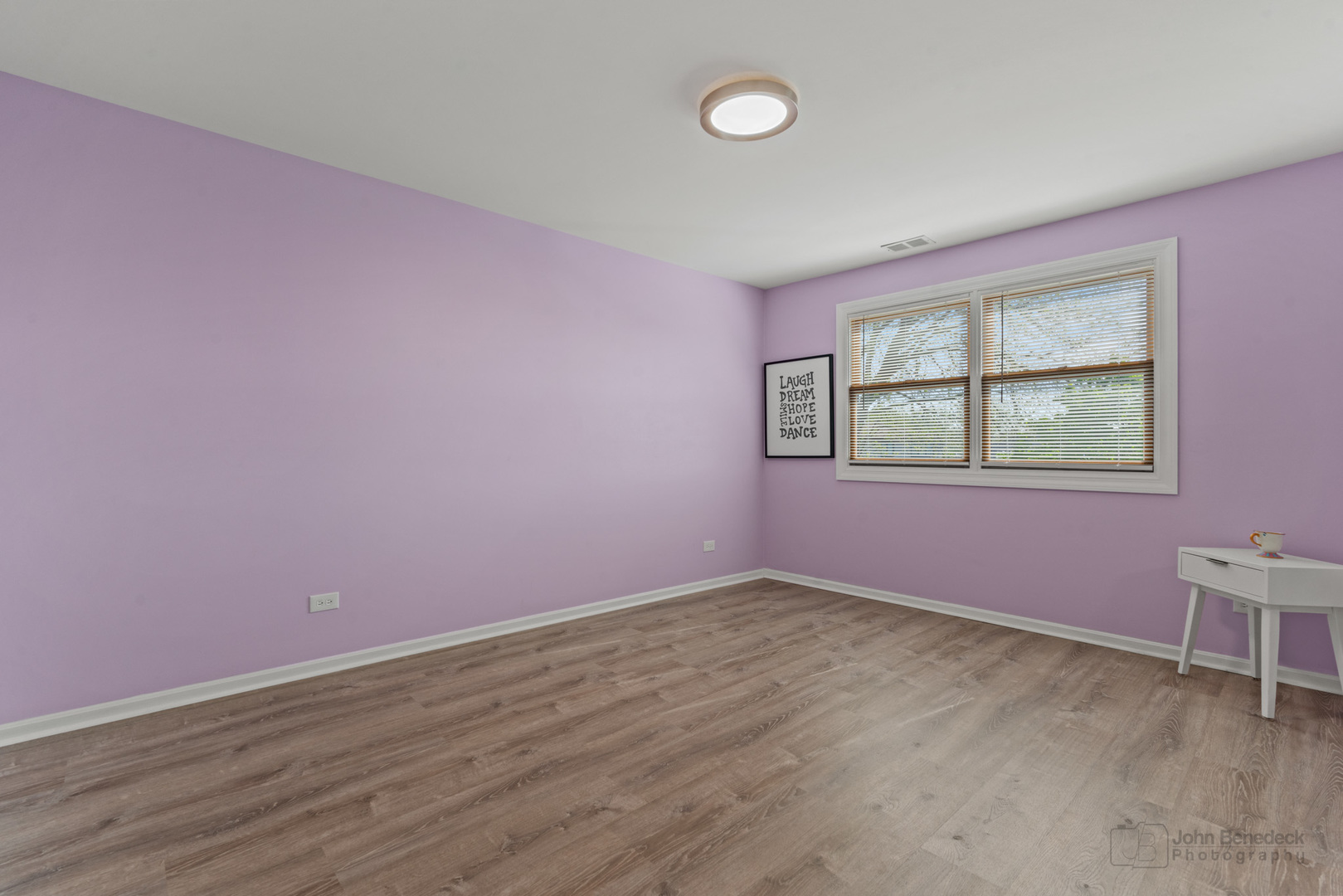 1223 Itasca Road Addison, IL 60101 - Photo 29 of 42 an empty room with wooden floor and windows