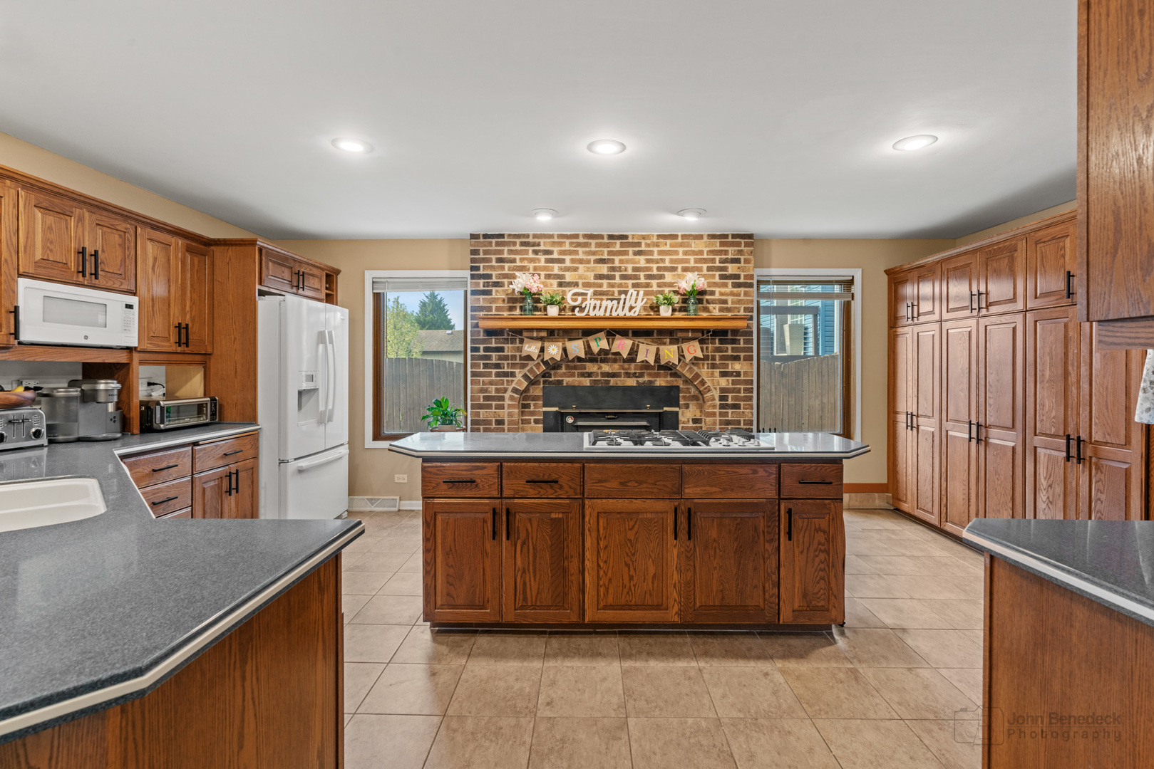 1223 Itasca Road Addison, IL 60101 - Photo 8 of 42 a kitchen with stainless steel appliances granite countertop a stove a sink and a refrigerator