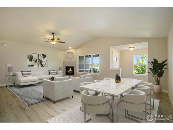 a living room with furniture and chandelier