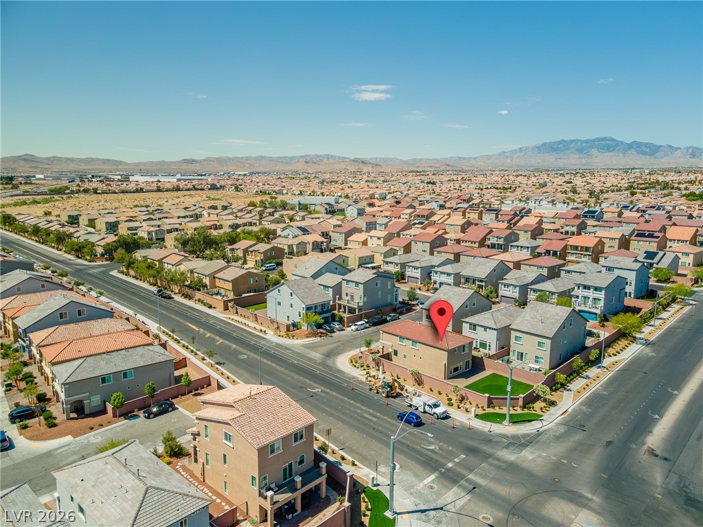 5510 Ripple Ridge Avenue Las Vegas, NV 89139 - Photo 8 of 45 This aerial view showcases a vibrant neighborhood nestled within a scenic desert landscape.