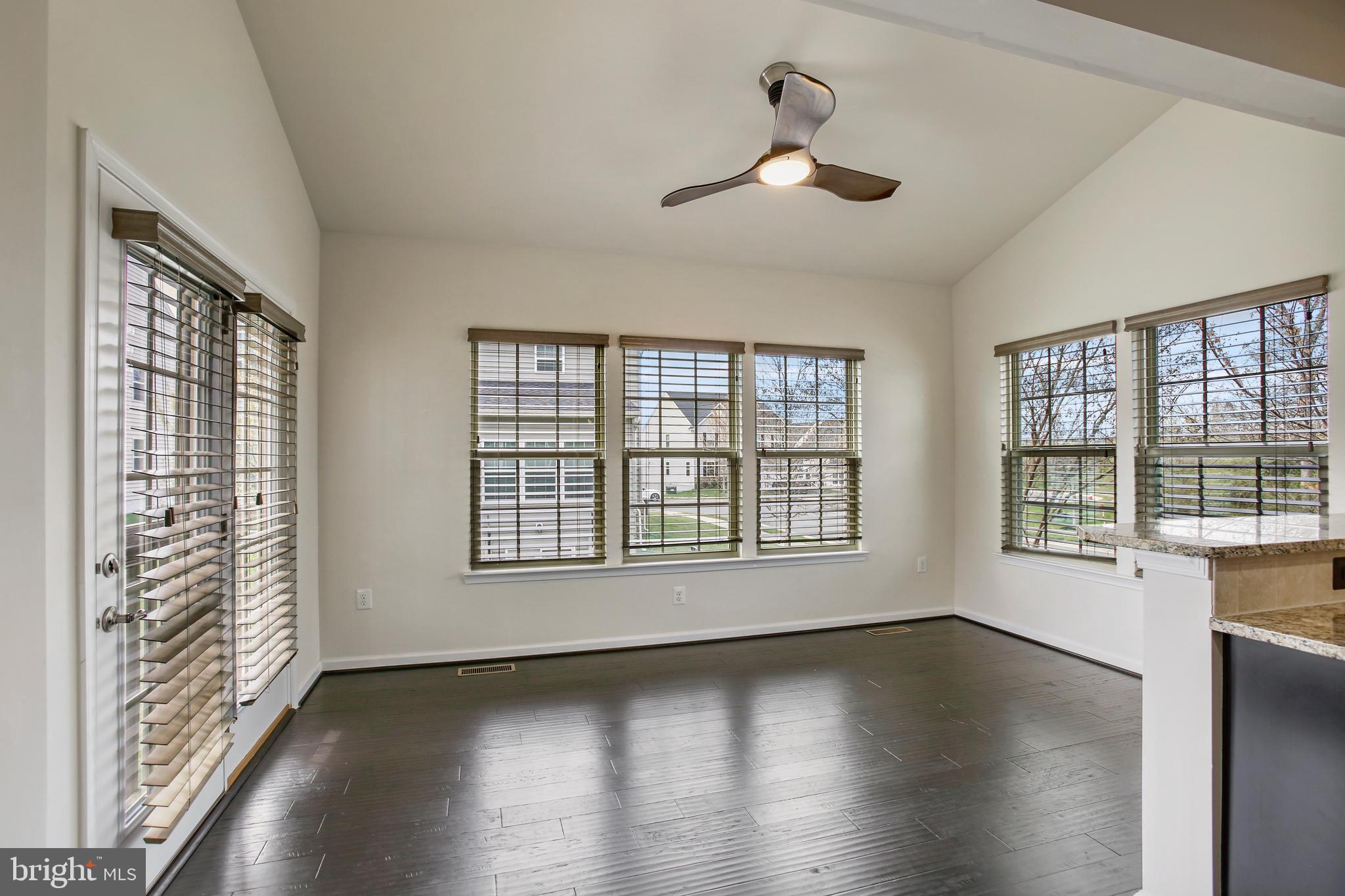 41597 Hoffman Drive Aldie, VA 20105 - Photo 11 of 42 a view of an empty room with wooden floor and a window