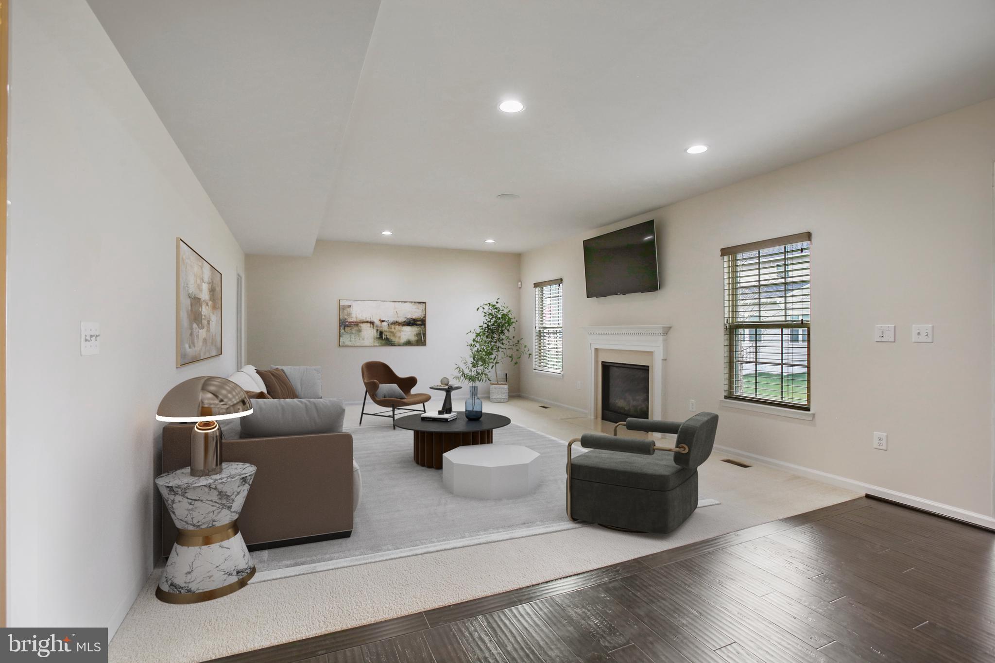 41597 Hoffman Drive Aldie, VA 20105 - Photo 12 of 42 a living room with fireplace furniture and a flat screen tv