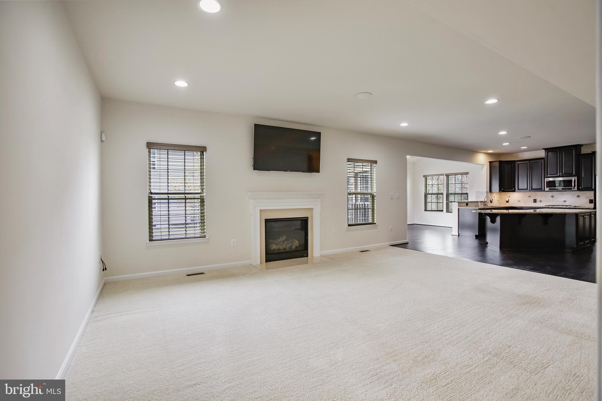 41597 Hoffman Drive Aldie, VA 20105 - Photo 14 of 42 a view of a livingroom with a fireplace