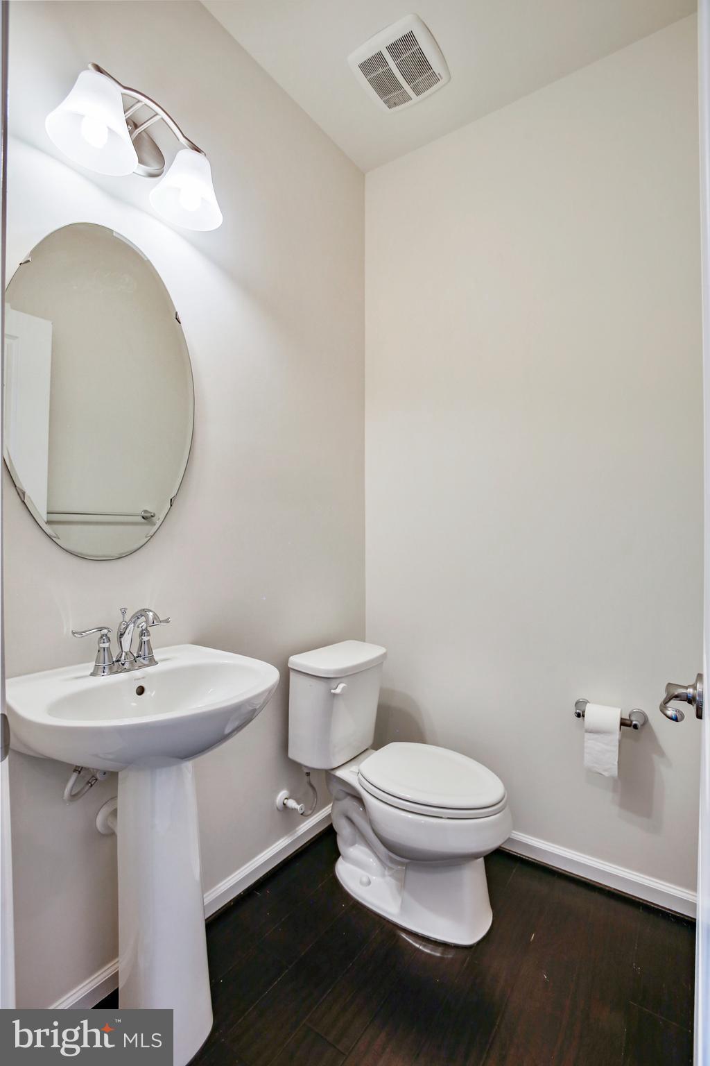 41597 Hoffman Drive Aldie, VA 20105 - Photo 17 of 42 a bathroom with a sink toilet and a mirror