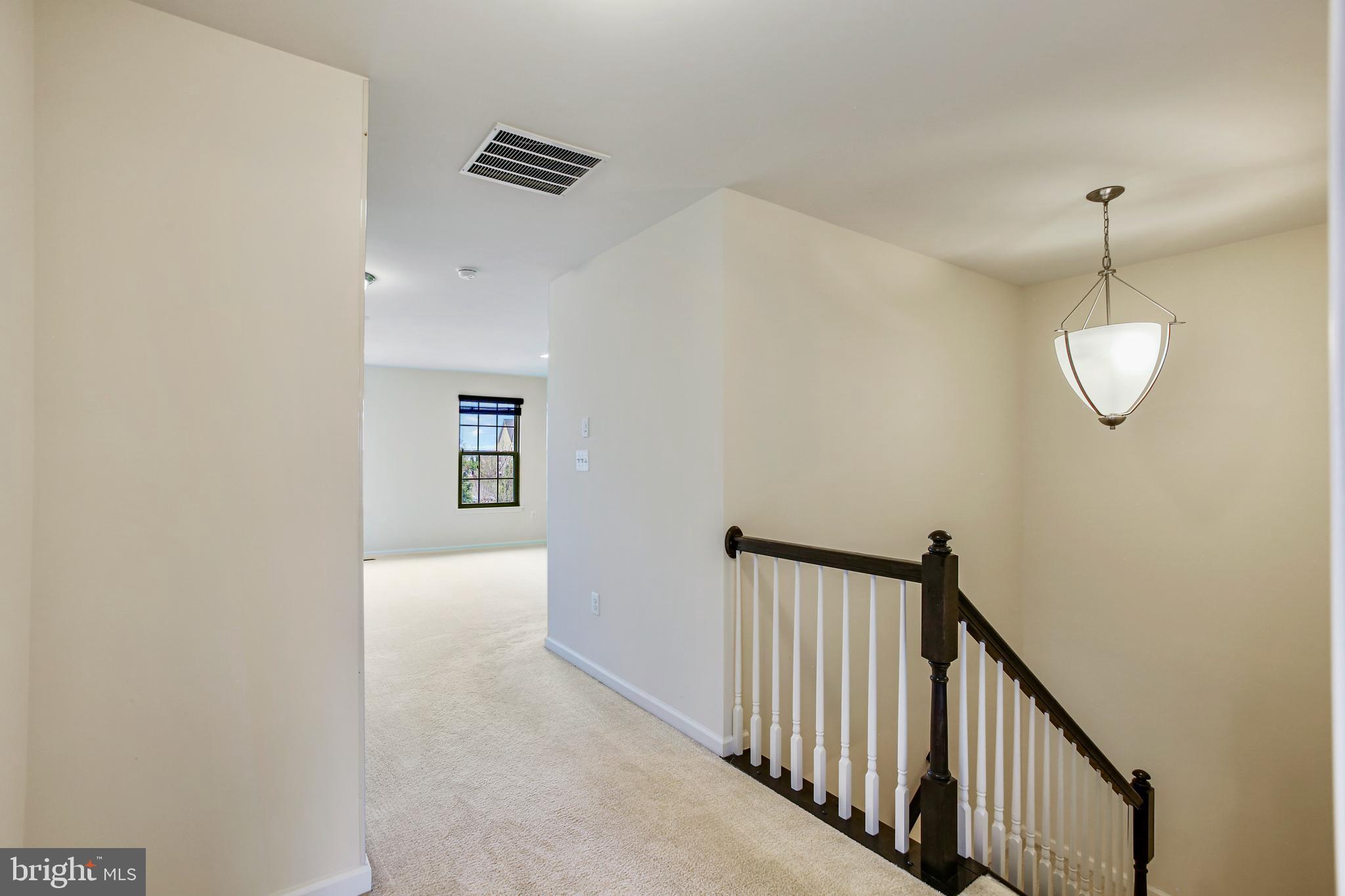 41597 Hoffman Drive Aldie, VA 20105 - Photo 18 of 42 a view of a hallway view with staircase