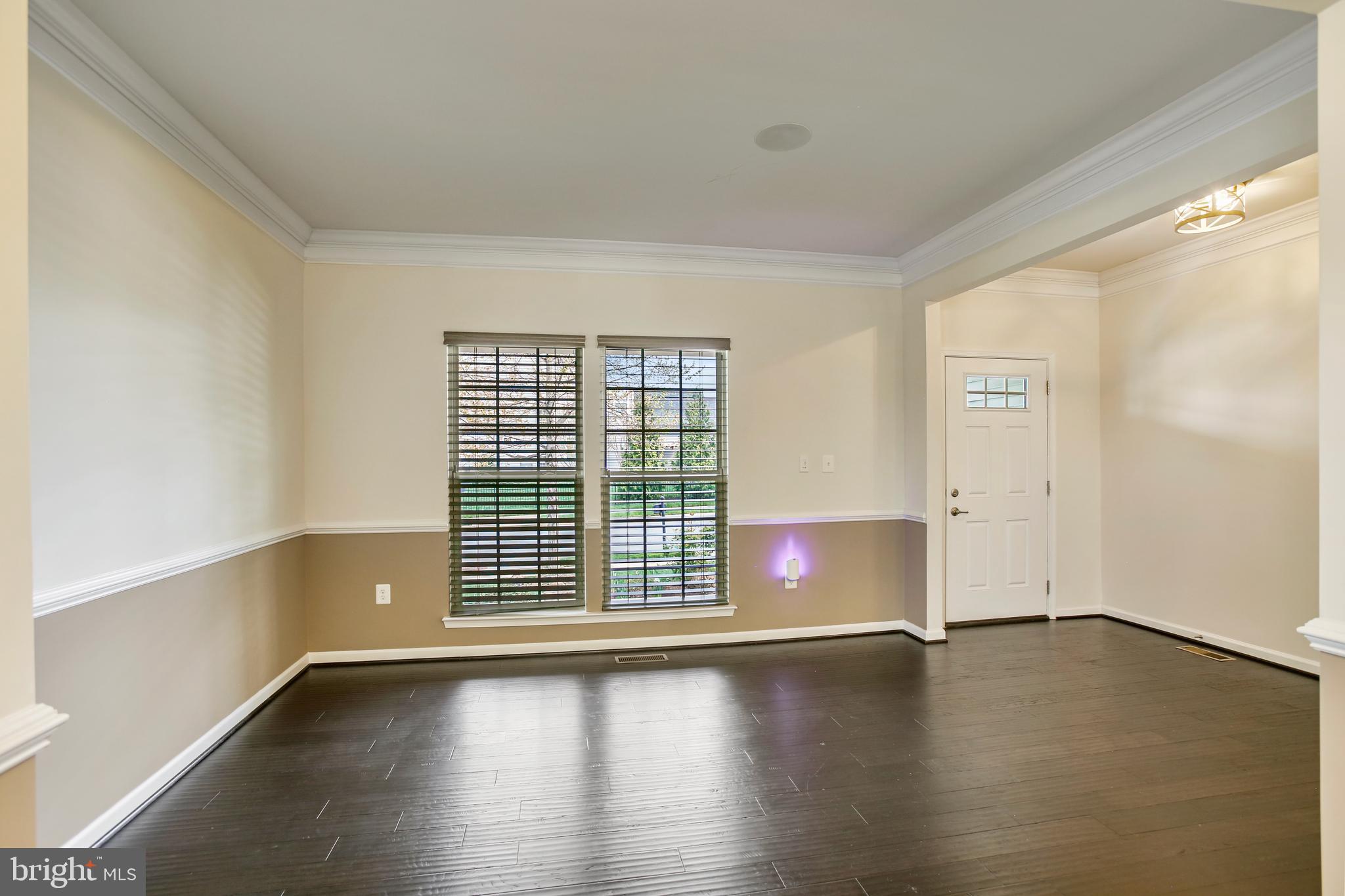 41597 Hoffman Drive Aldie, VA 20105 - Photo 2 of 42 an empty room with wooden floor and windows