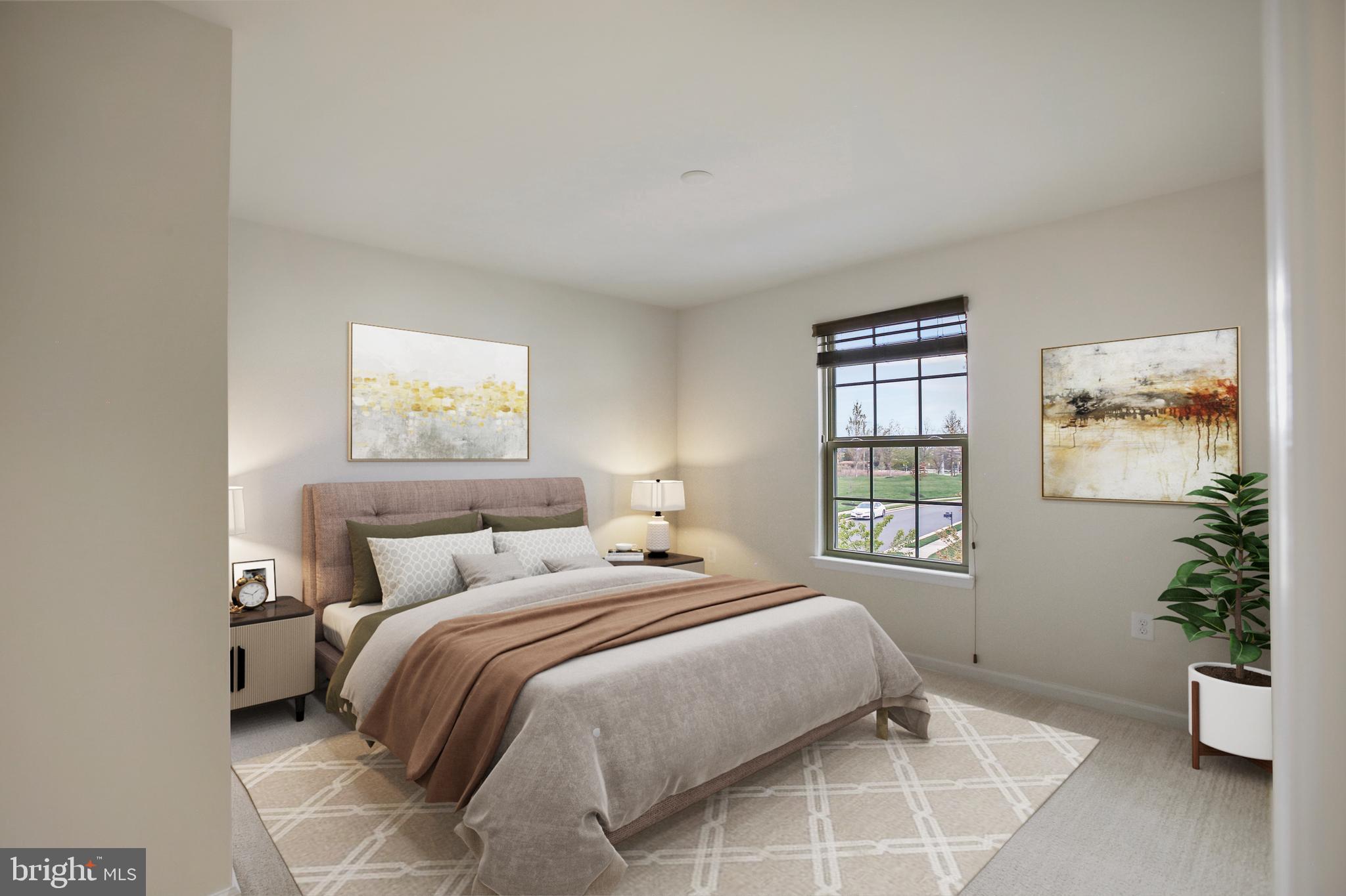 41597 Hoffman Drive Aldie, VA 20105 - Photo 27 of 42 a bedroom with a large bed and a potted plant