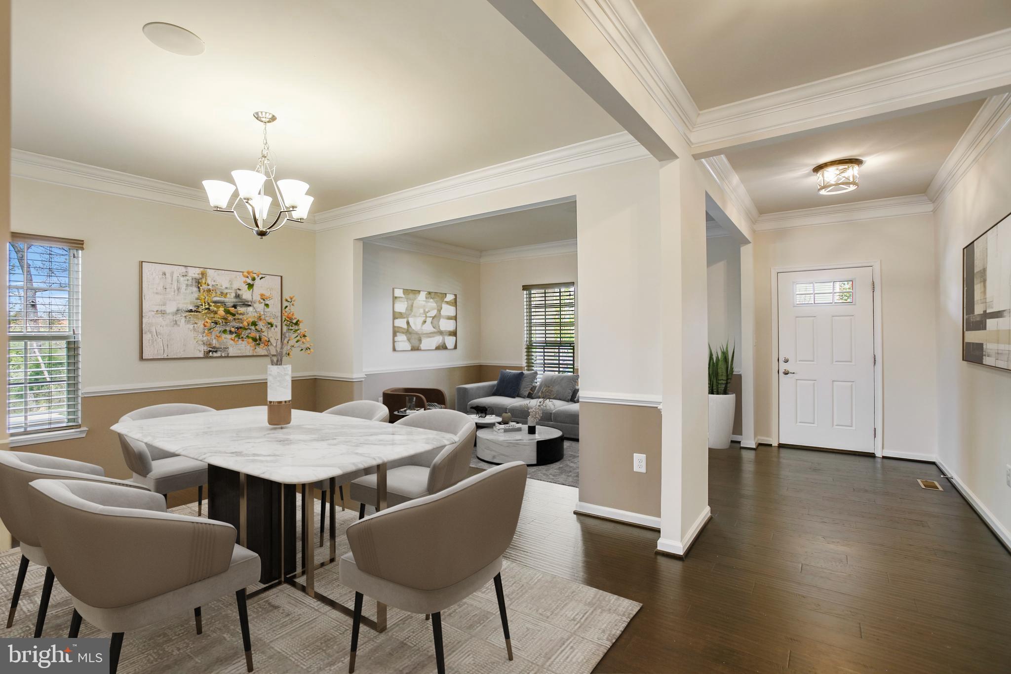 41597 Hoffman Drive Aldie, VA 20105 - Photo 3 of 42 a dining room with wooden floor a chandelier a wooden table and chairs