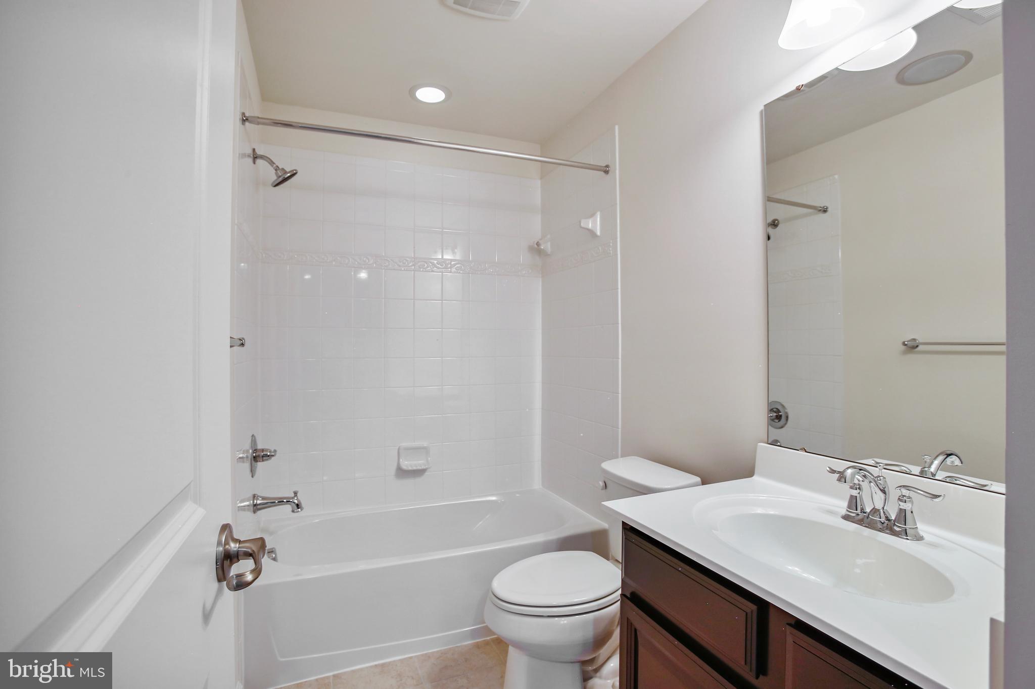 41597 Hoffman Drive Aldie, VA 20105 - Photo 37 of 42 a bathroom with a sink toilet tub and shower