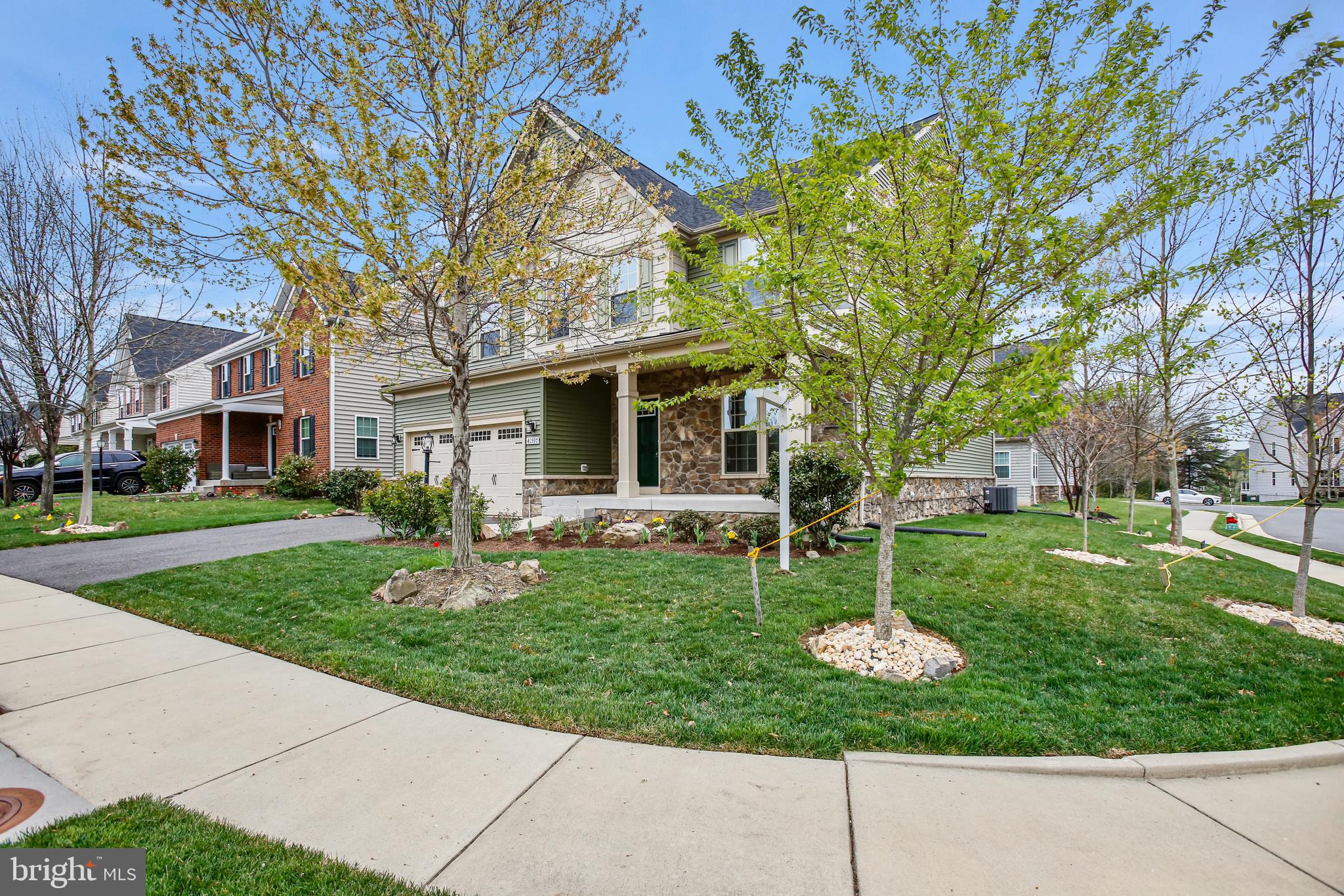 41597 Hoffman Drive Aldie, VA 20105 - Photo 42 of 42 a front view of a house with garden