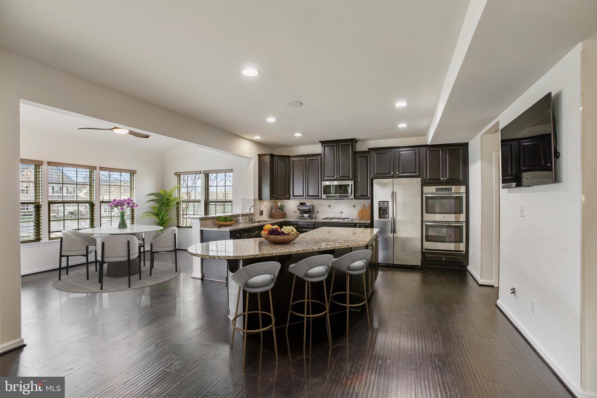 41597 Hoffman Drive Aldie, VA 20105 - Photo 6 of 42 a view of a dining room with furniture window and wooden floor
