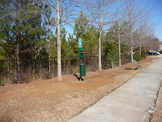 a view of swimming pool with a table and chairs