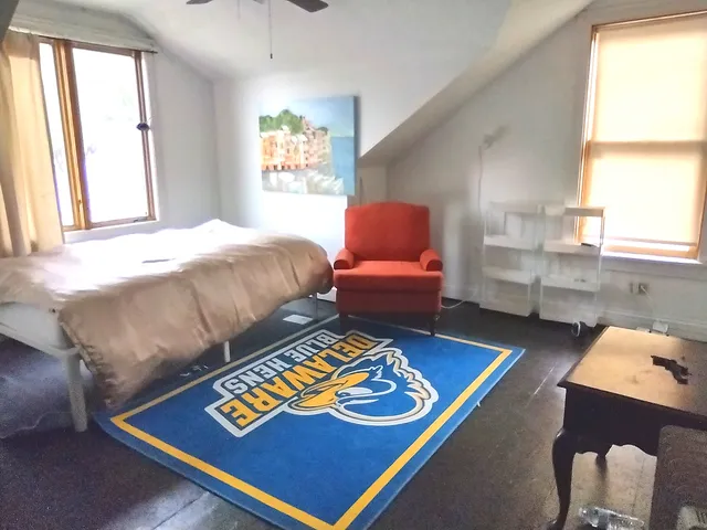 a bed room with a bed and a window