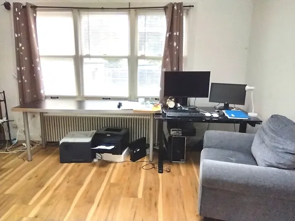 a workspace with furniture and window