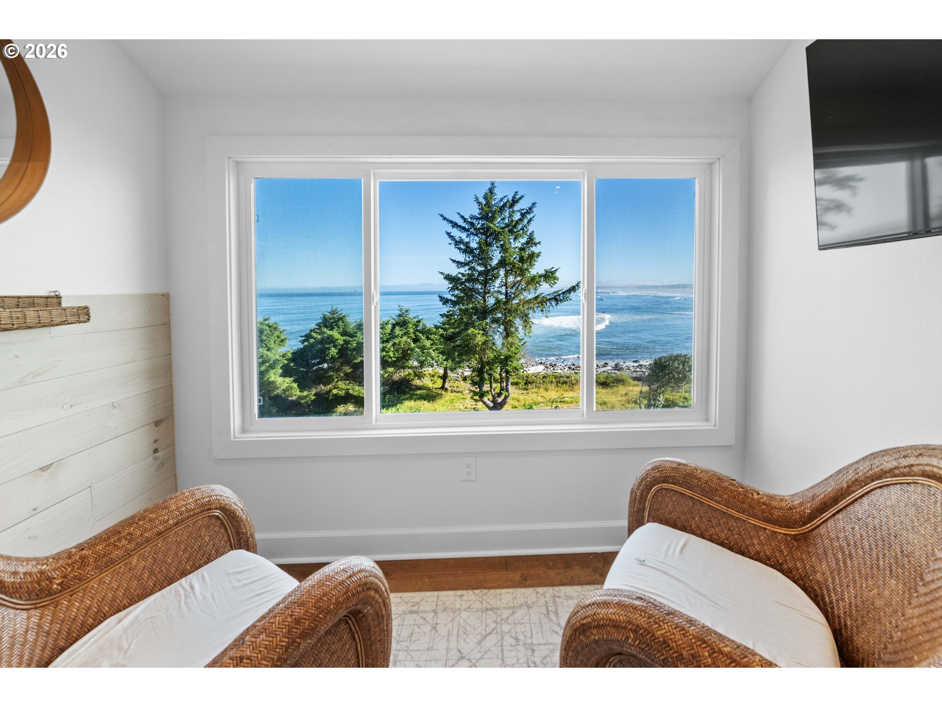 3232 Sunset Boulevard Seaside, OR 97138 - Photo 22 of 48 a bedroom with a bed and a window