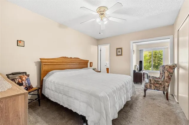 a bedroom with bed and window