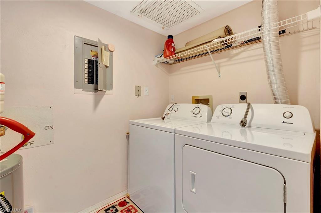 234 Pebble Beach Boulevard, Unit 305 Naples, FL 34113 - Photo 15 of 17 a utility room with dryer and washer