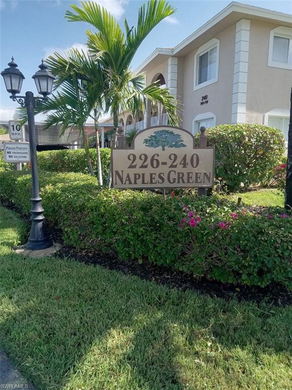 234 Pebble Beach Boulevard, Unit 305 Naples, FL 34113 - Photo 17 of 17 a view of a house with a garden