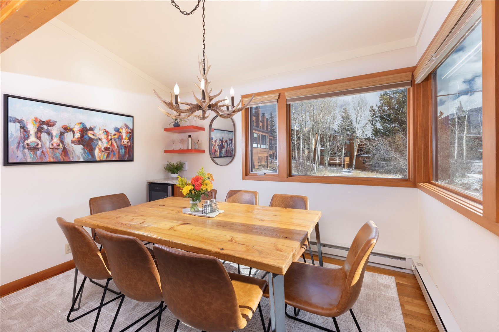 590 Tennis Club Road, Unit 1336 Keystone, CO 80435 - Photo 11 of 41 a dining room with furniture a chandelier and wooden floor