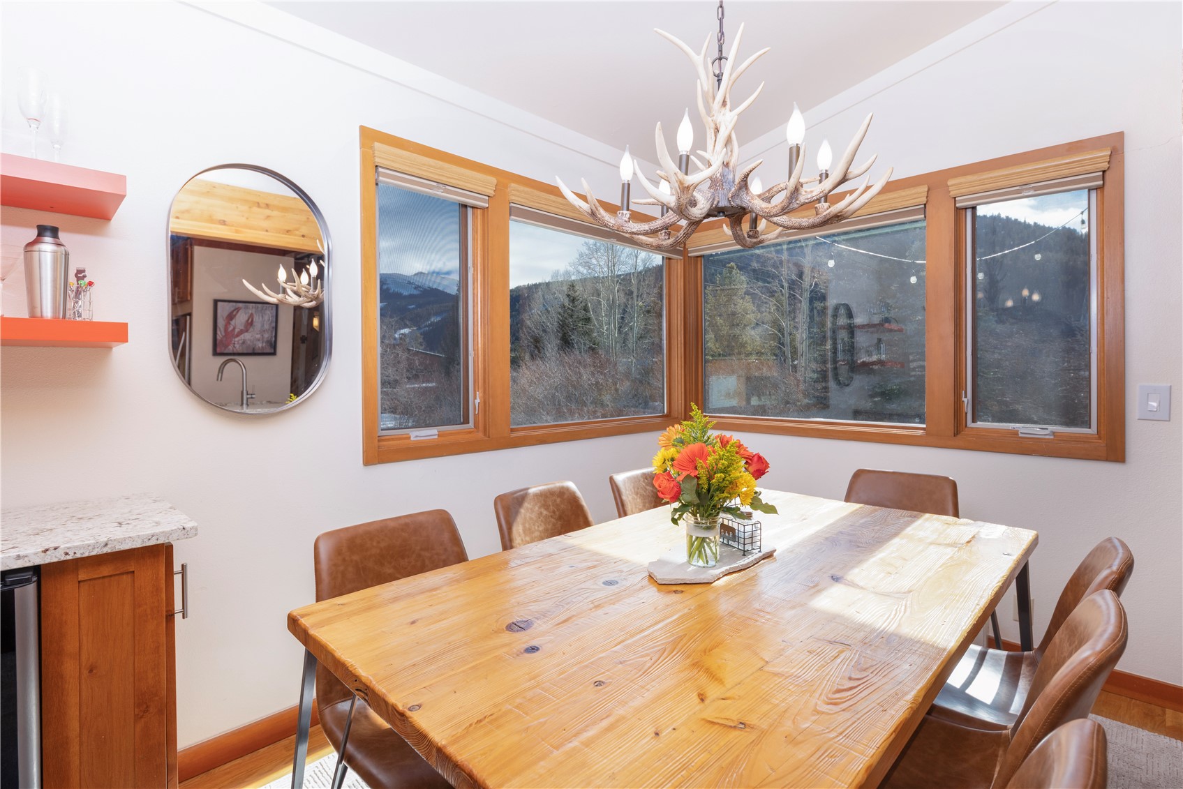 590 Tennis Club Road, Unit 1336 Keystone, CO 80435 - Photo 12 of 41 a view of a dining room with furniture a chandelier and wooden floor