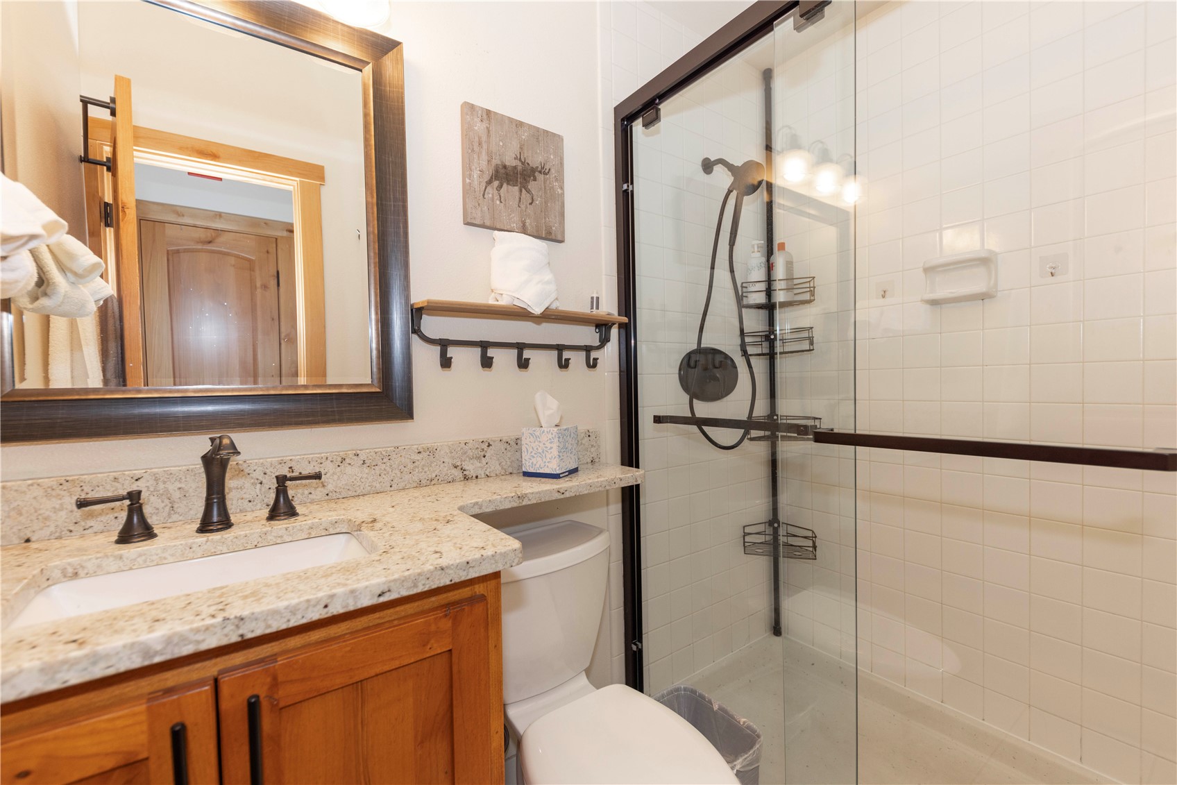 590 Tennis Club Road, Unit 1336 Keystone, CO 80435 - Photo 25 of 41 a bathroom with a granite countertop sink mirror vanity and toilet