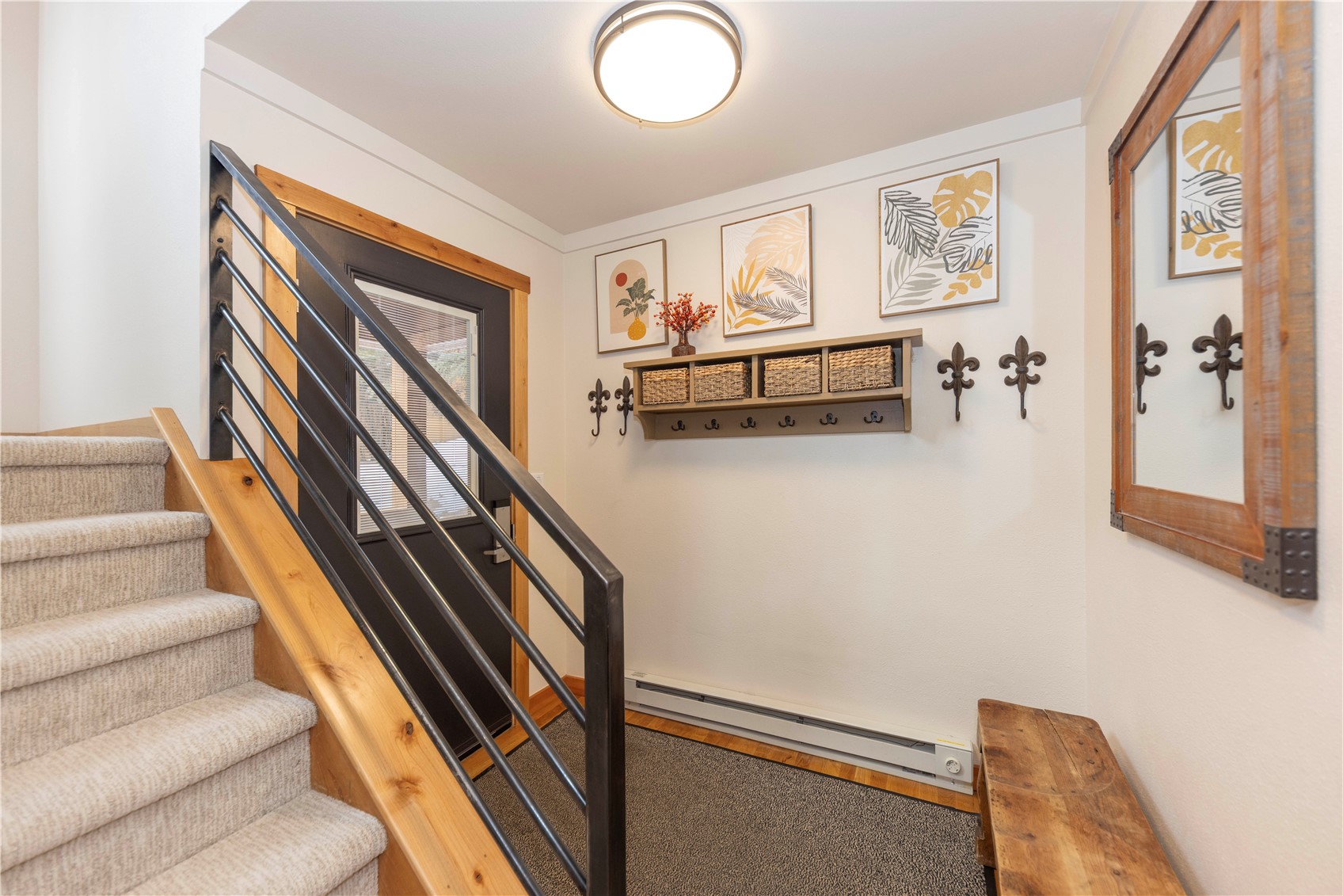 590 Tennis Club Road, Unit 1336 Keystone, CO 80435 - Photo 28 of 41 a view of staircase with lots of frames on wall and a window
