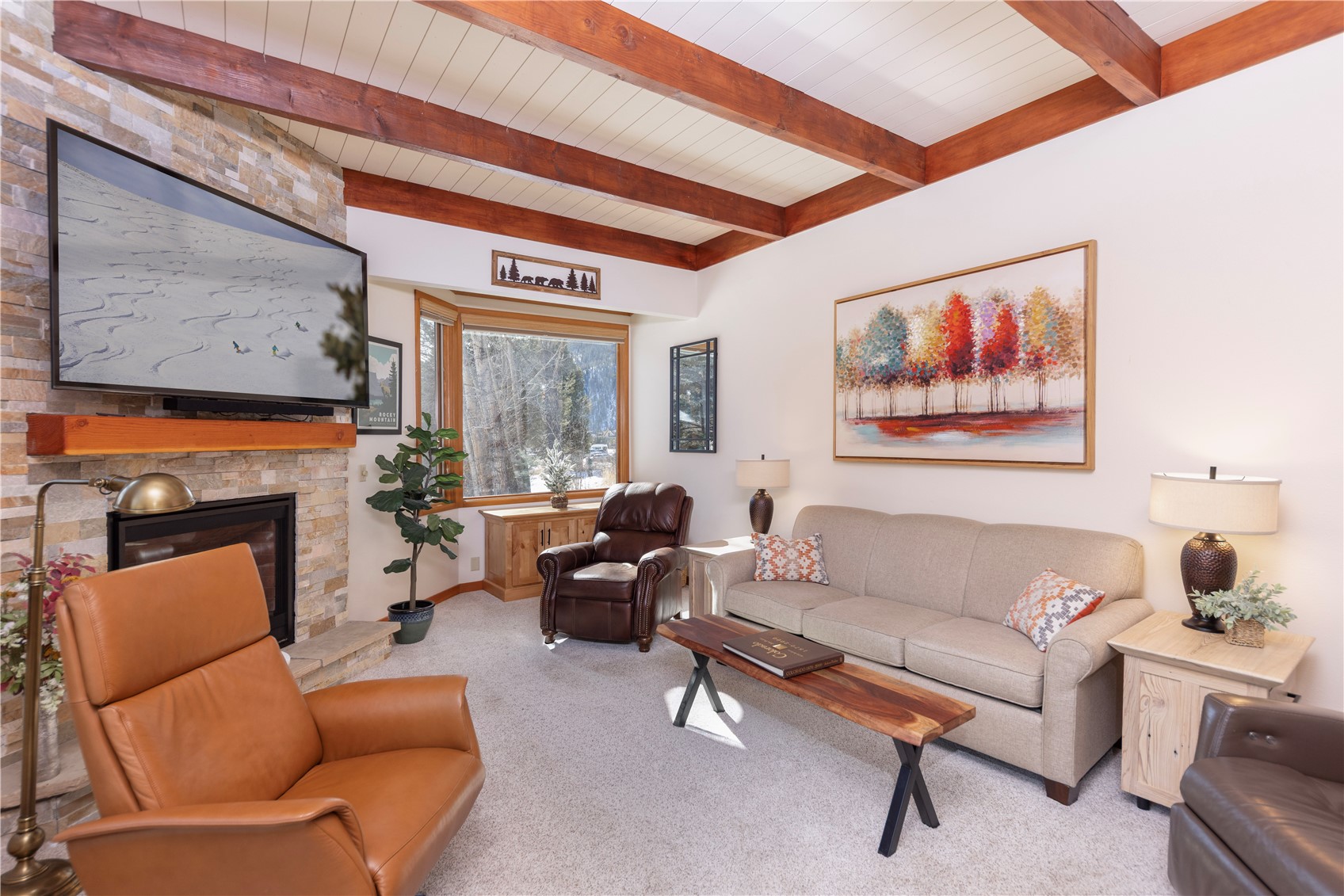 590 Tennis Club Road, Unit 1336 Keystone, CO 80435 - Photo 4 of 41 a living room with furniture a fireplace and a large window