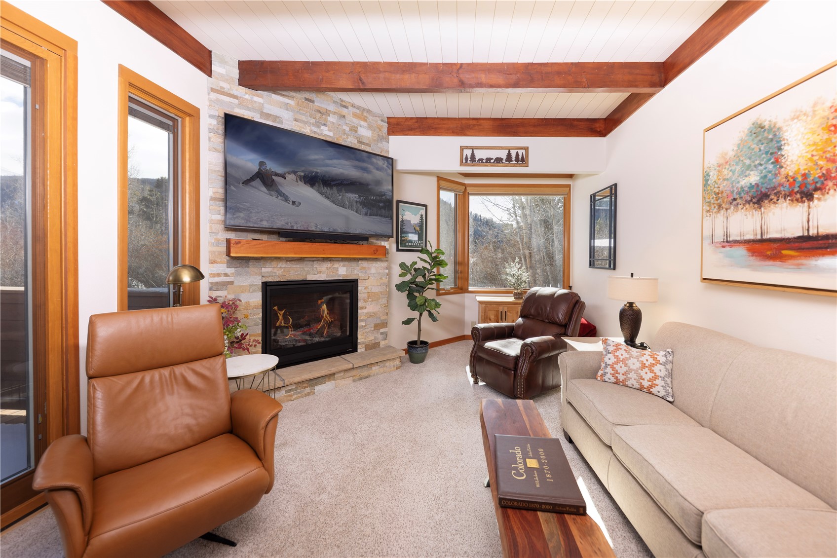590 Tennis Club Road, Unit 1336 Keystone, CO 80435 - Photo 5 of 41 a living room with furniture a large window and a fireplace