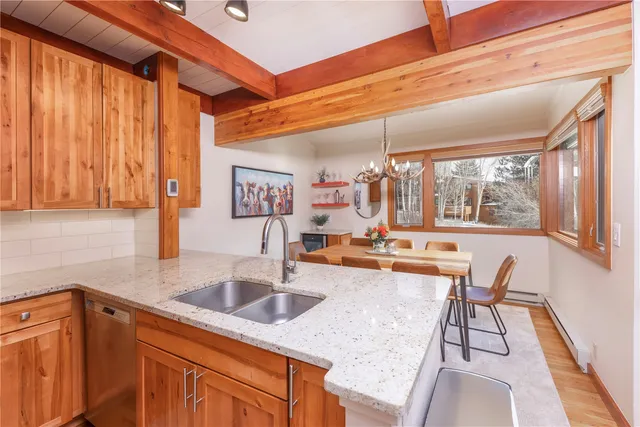 a kitchen with stainless steel appliances granite countertop sink and cabinets