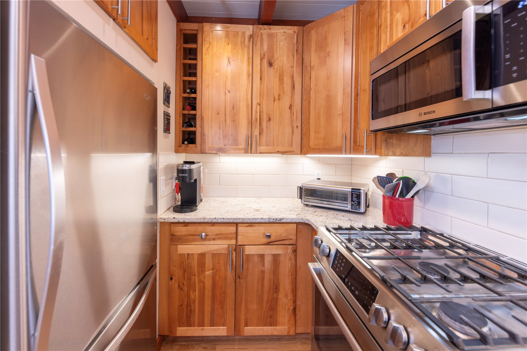 590 Tennis Club Road, Unit 1336 Keystone, CO 80435 - Photo 9 of 41 a kitchen with stainless steel appliances granite countertop a stove and a microwave