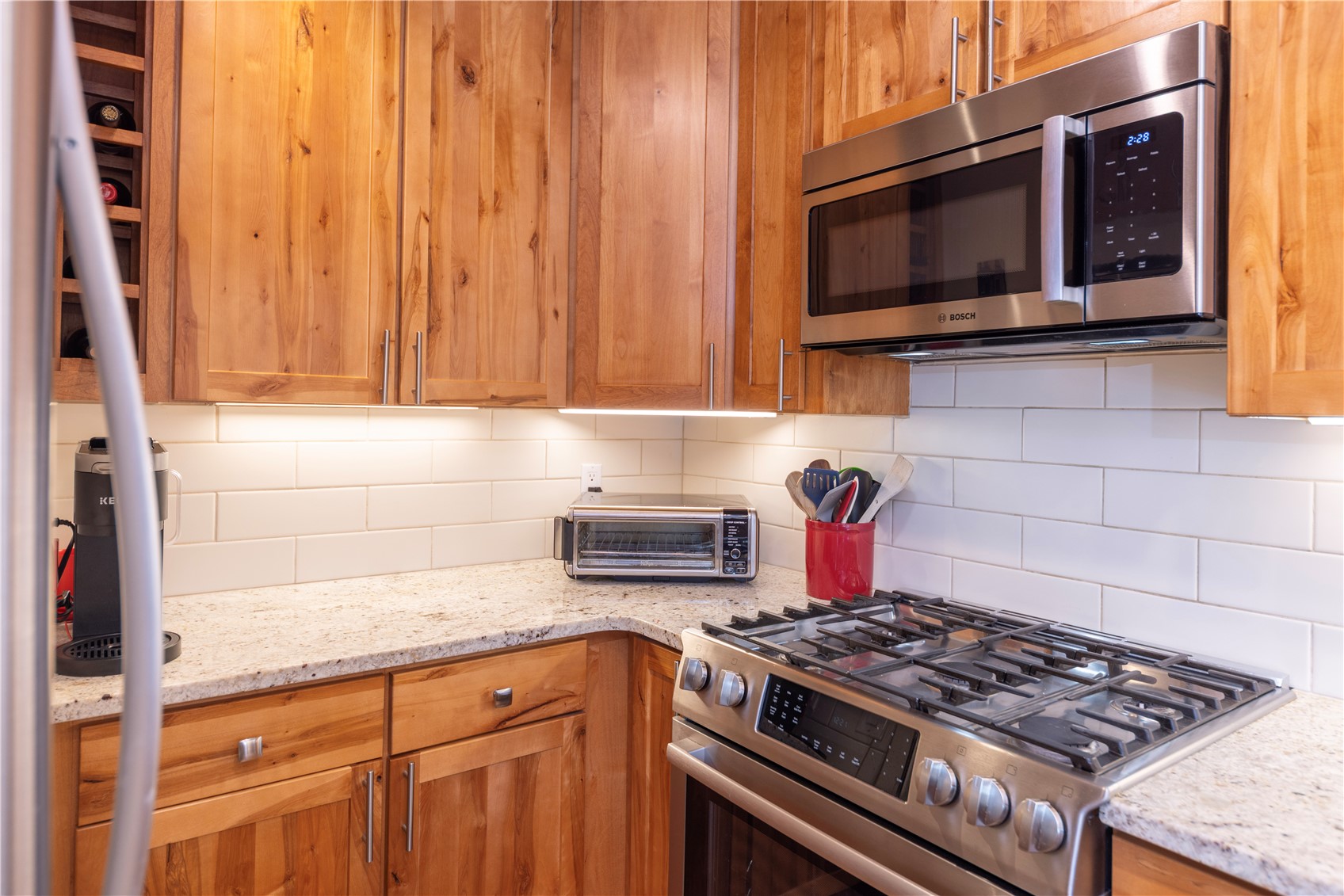 590 Tennis Club Road, Unit 1336 Keystone, CO 80435 - Photo 10 of 41 a kitchen with stainless steel appliances granite countertop a stove and a microwave