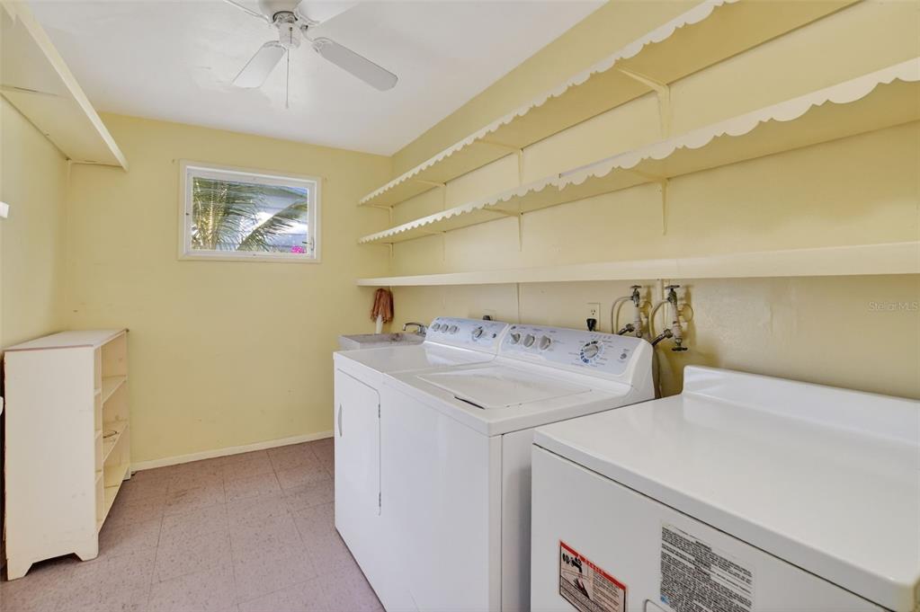 450 Northwest 12th Avenue Boca Raton, FL 33486 - Photo 19 of 58 a utility room with dryer and washer