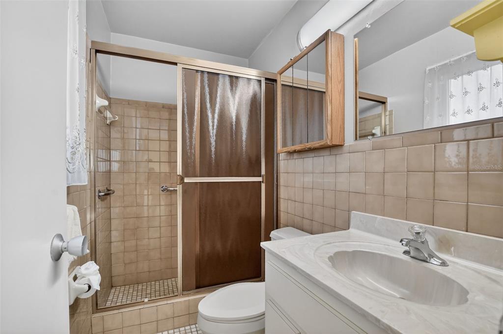 450 Northwest 12th Avenue Boca Raton, FL 33486 - Photo 27 of 58 a bathroom with a sink toilet and shower