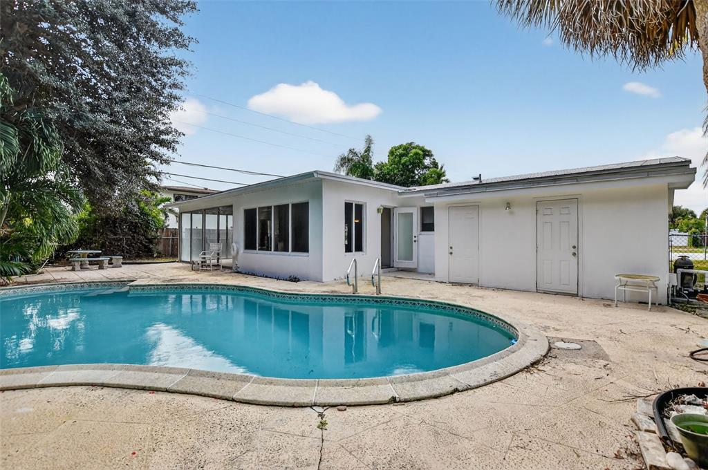 450 Northwest 12th Avenue Boca Raton, FL 33486 - Photo 37 of 58 a view of a house with swimming pool