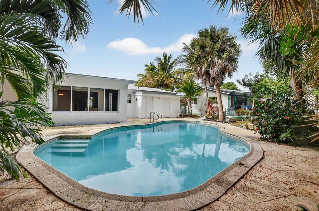450 Northwest 12th Avenue Boca Raton, FL 33486 - Photo 39 of 58 a view of a house with swimming pool