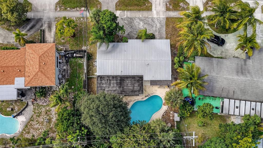 450 Northwest 12th Avenue Boca Raton, FL 33486 - Photo 56 of 58 an aerial view of a house with swimming pool and garden
