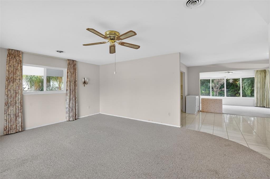 450 Northwest 12th Avenue Boca Raton, FL 33486 - Photo 7 of 58 a view of a livingroom with a ceiling fan and window