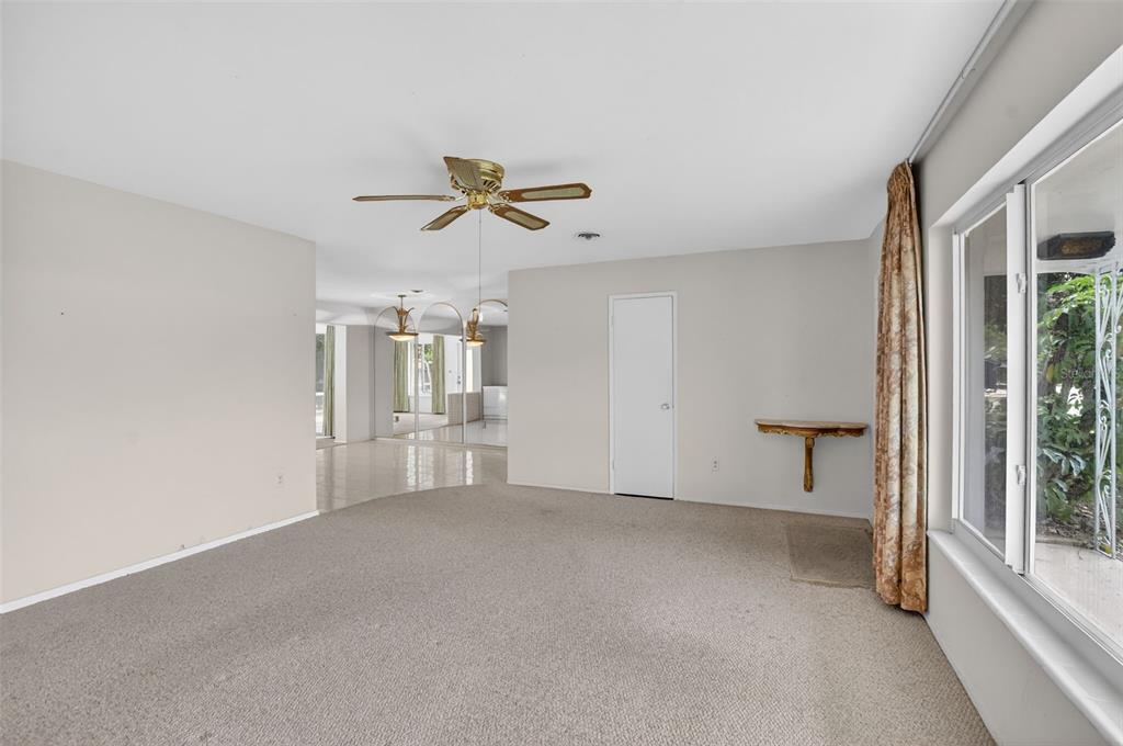 450 Northwest 12th Avenue Boca Raton, FL 33486 - Photo 8 of 58 a view of a livingroom with a ceiling fan and window